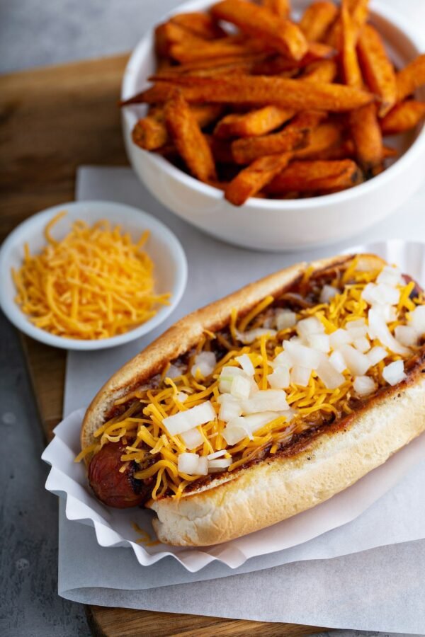 Chili hot dog topped with cheese