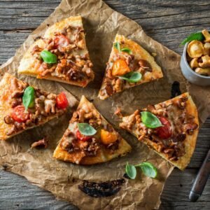 Homemade pizza with chanterelle mushrooms and vegetables. Rustic mushroom pizza.