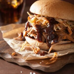 homemade pulled pork burger with coleslaw and bbq sauce