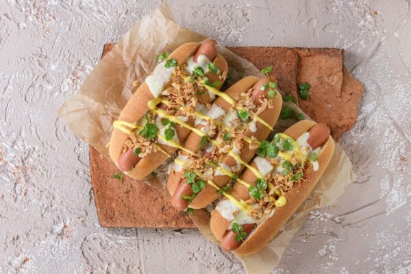 Hot dogs with cheese sauce and mustard