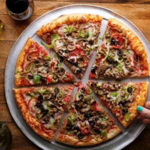 Vegetarian pizza with vegetables and mushrooms